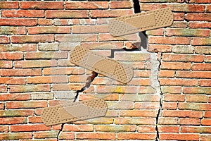 Renovation of an old cracked brick wall - concept image with bandaid patch