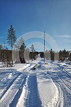 Renovation of power line in northern Sweden with a tracked vehicle