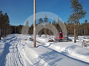 Renovation of power line in northern Sweden with a tracked vehicle