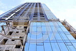 Renovation and reconstruction of the facade of a modern residential building.