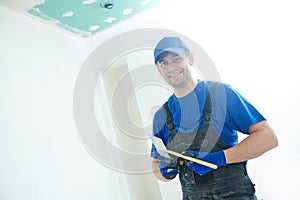 Refurbishment. happy plasterer portrait with tools photo