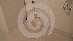 The renovation and renovation of a bathroom by a construction worker. Bathroom tiles. Renovation in the bathroom