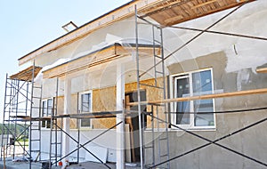 Renovation of the Rural House with Plastering and Painting in White Color Exterior House Wall.