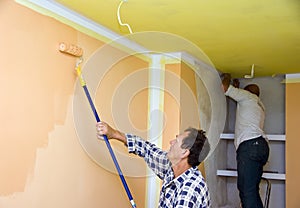 Renovation team painting room