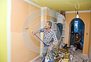 Renovation team painting room