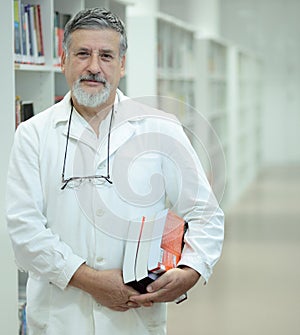 Renowned scientist/doctor in a library