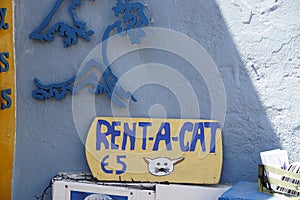 Rent a cat sign in Santorini, Greece