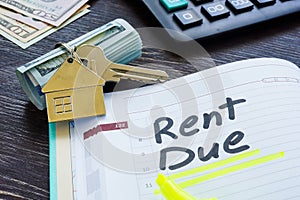 Rent due sign in the planner and key.