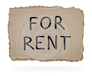 For rent inscription on piece of cardboard.