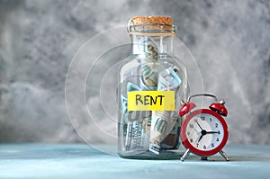 Rent. Money for rental concept with glass jar labeled rent