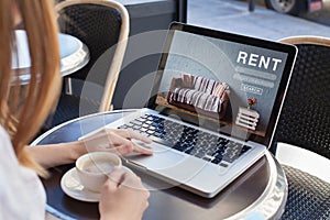 Rent online concept, woman using internet website for rental apartments