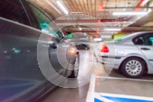 Rent parking space blurred. Car lot parking space in underground city garage. Empty road asphalt background in soft focus. Parking