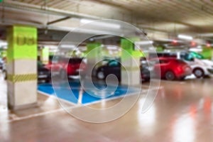 Rent parking space blurred. Car lot parking space in underground city garage. Empty road asphalt background in soft focus. Parking