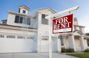 For Rent Real Estate Sign in Front of House photo