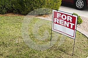 For rent sign with homes in background