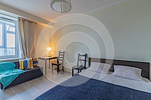 Rental apartment with bed chairs sofa and table