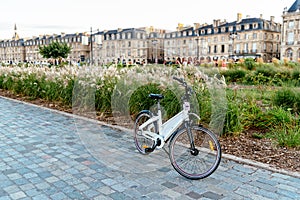 Rental bicycle parked in street in Bordeaux