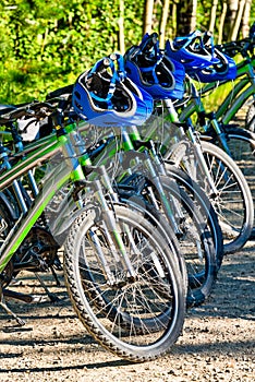 Rental bikes and helmets ready for adventure tour