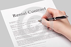 Rental contract form with pen