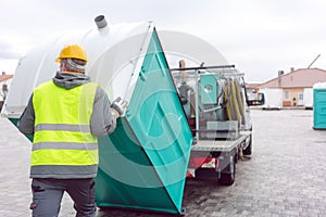 Rental lavatory being loaded on truck