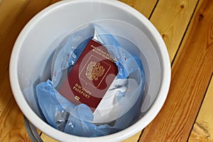 renunciation of Russian citizenship. travel ban. Russian passport in trash can