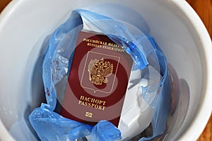 renunciation of Russian citizenship. travel ban. Russian passport in trash can