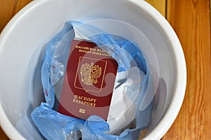 renunciation of Russian citizenship. travel ban. Russian passport in trash can