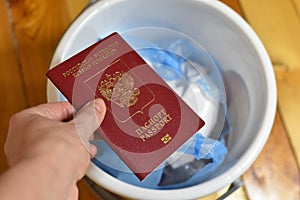 renunciation of Russian citizenship. travel ban. Russian passport in trash can