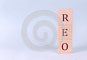 REO on wooden cubes on a blue background photo