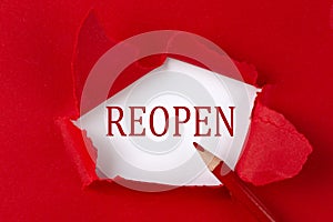 REOPEN text on the red torn paper with red pencil