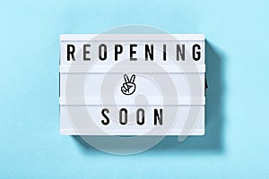 Reopening soon Light box with text blue background