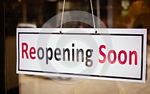 Reopening Soon Signage board in front of Businesses or Restaurant door after covid-19 or coronavirus outbreak - Concept