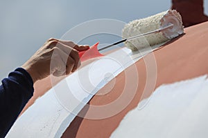 Repainting shell by roller brush