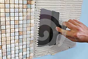 Repair in the apartment: installing the mosaic tile on the wall