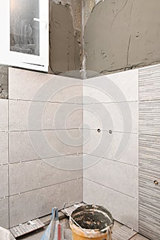 Repair the bathroom. Renovation at home unfinished tiles