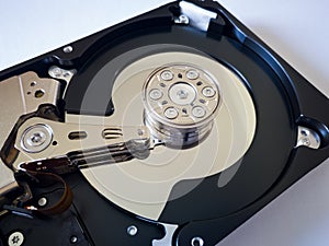 Repair broken computer part, close up of open hard disc drive hdd with platters, spindle, actuator and read/write head isolated