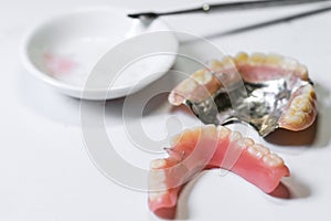 Repair broken denture