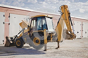 Repair of a broken excavator. Excavator without a wheel. Breakdown of a construction loader during operation