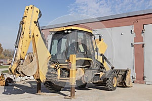 Repair of a broken excavator. Excavator without a wheel. Breakdown of a construction loader during operation