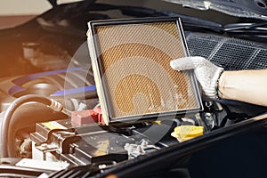 Repair and check car air conditioning system Technician holds car air filter to check cleanliness Clogging dirty or replacing the