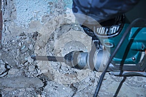 Repair and construction working indoors. Grunge background rubble and stones.