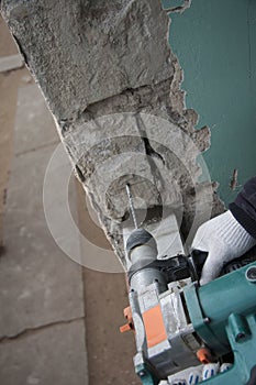 Repair and construction working indoors. Grunge background rubble and stones