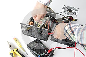 repair of a disassembled Computer Power Supply Unit, tester measurement