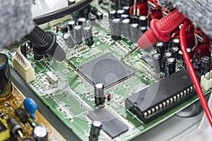 Technician repair DVD Player motherboard.