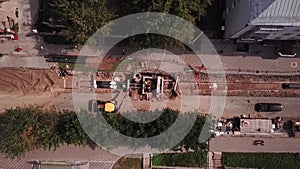 Repair of heating mains in a small Russian city aerial view from above