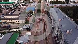 Repair of heating mains in a small Russian city aerial view from above