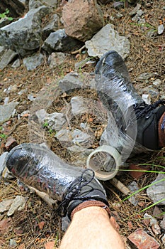 Repair hiking boots with scotch tape