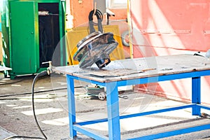 Repair of the impeller for a pump with blades in the industrial premises of the shop at an oil refinery, chemical plant