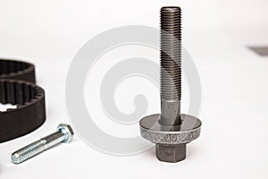 Repair kit: gear belt and bolts  on a white background. Car spare parts