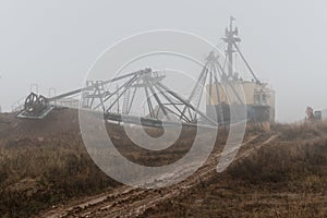 Repair with lowering the boom of a walking excavator in a clay quarry